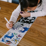 Child colouring with the hey Doodle Habitats Tales