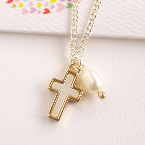 Lauren Hinkley Cross pendant necklace with a freshwater pearl charm.