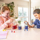 Children doing a colour experiment activity from Rainbow Lab playing with colour