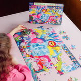 Child completing the Eeboo 100 piece Magical Creatures jigsaw puzzle