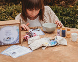 A child playing with the Moon Magic Mindful Potion Kit