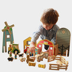 Child playing with Happy Architect Wooden farm